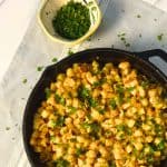 Cast iron pan full of crispy breakfast potatoes